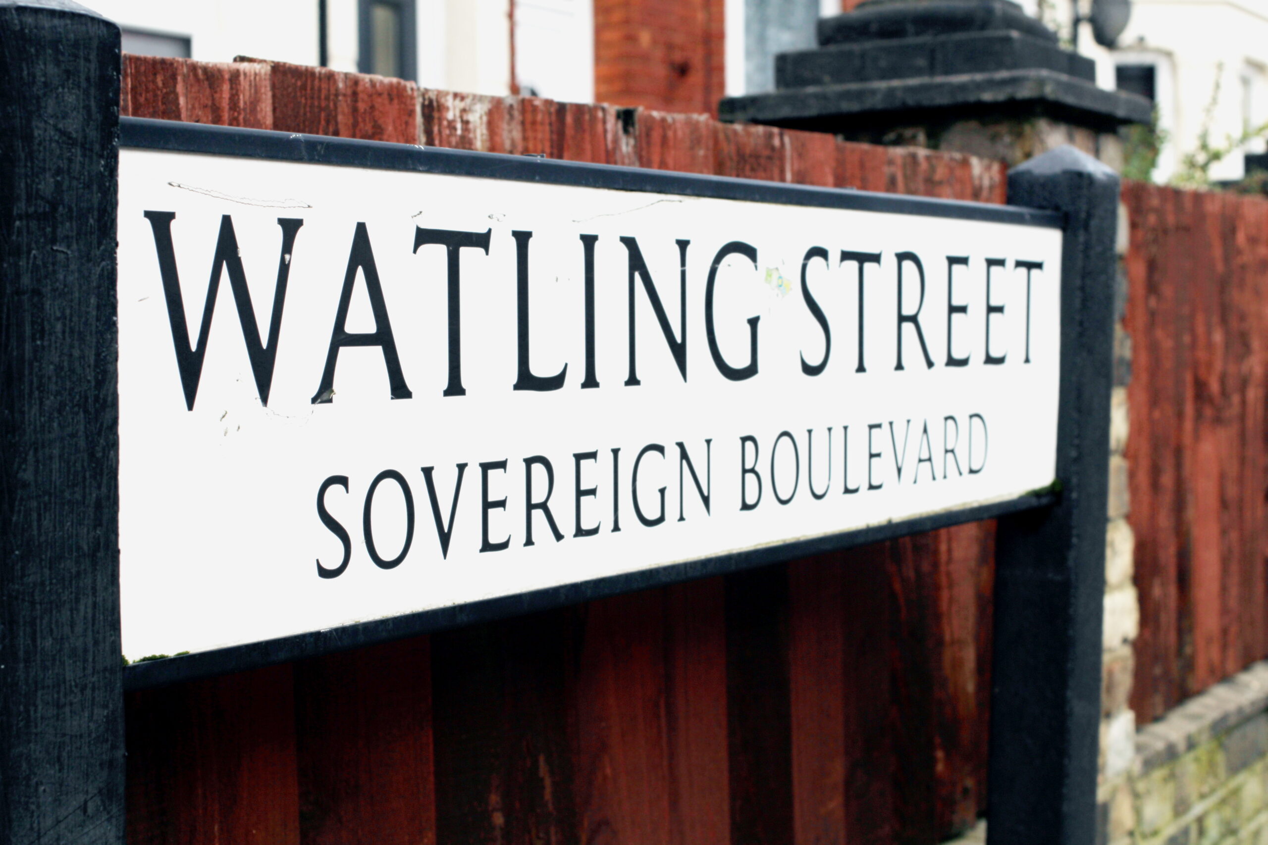 An image of a pavement street sign that says 'Watling Street Sovereign Boulevard.'