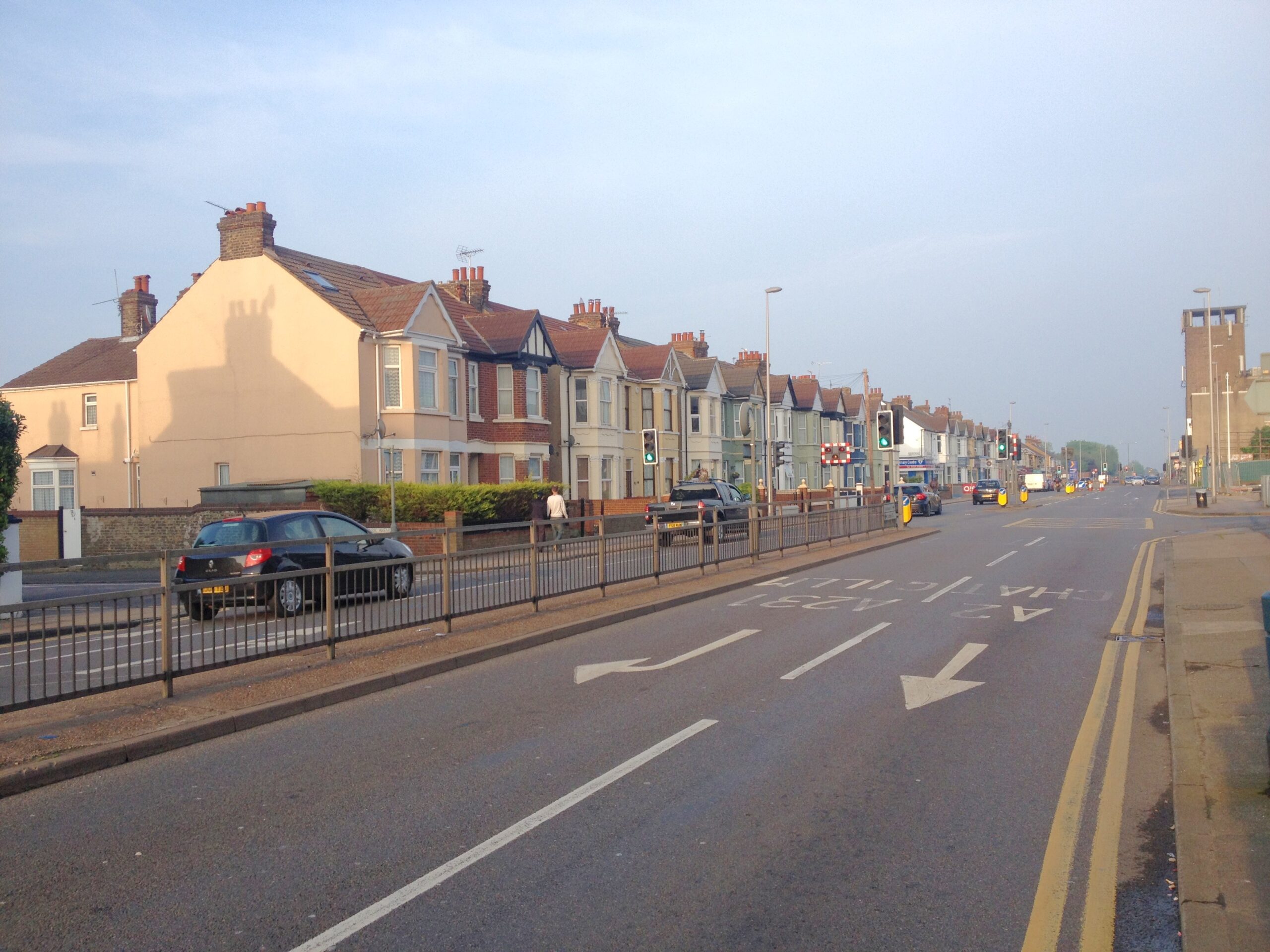 A view of Watling Street, Gillingham in early evening. Houses are visible on the right hand side, and the old Palace Cinema building is in the distance on the left.