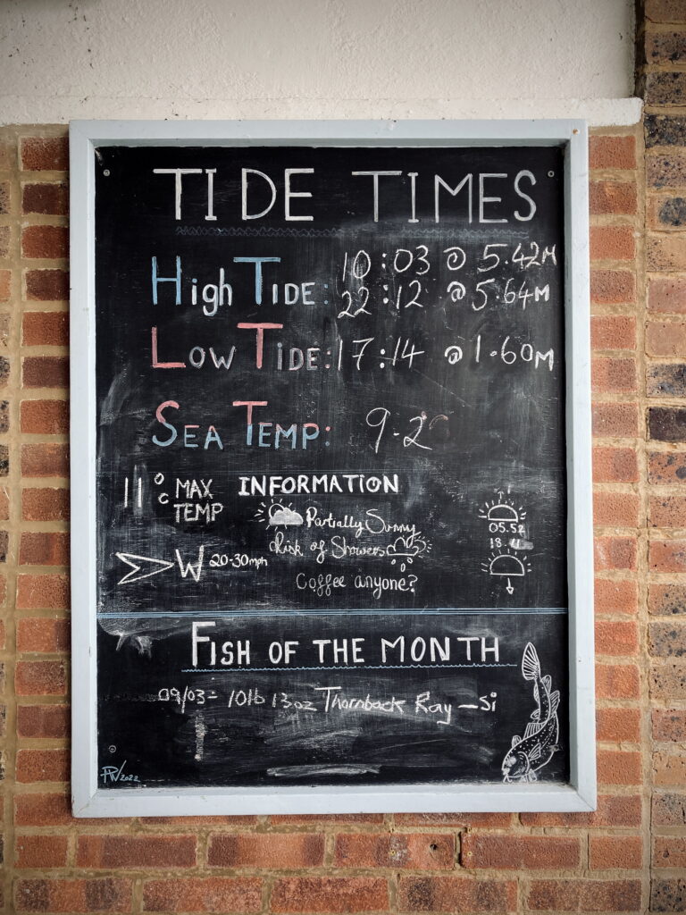 A chalkboard showing the tide times at Deal, and the fish of month, which on 9 March was a 10lb 13 oz Thornbeck Ray, caught by Si.