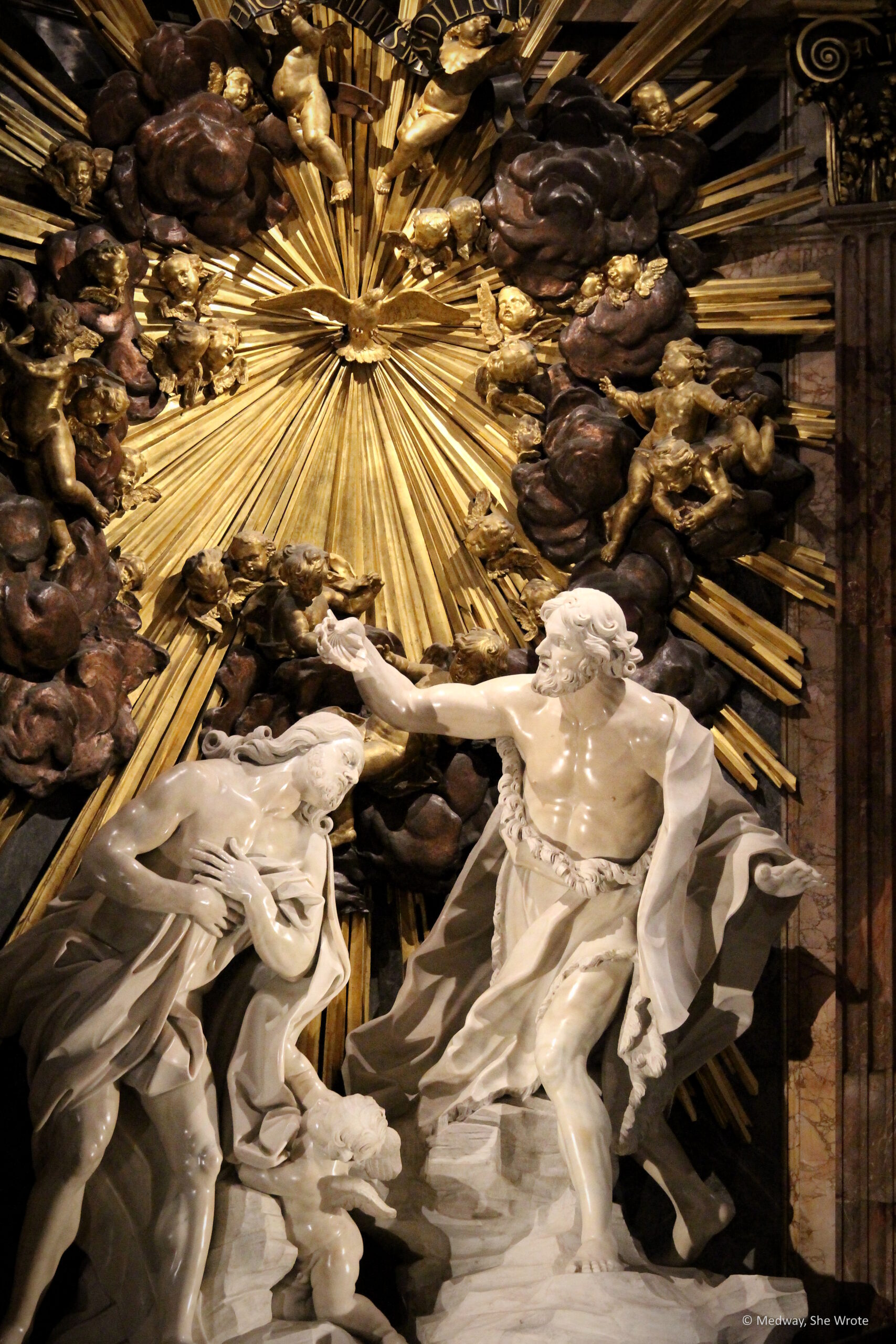 A close-up of the altar at St John's Co-Cathedral. It is a marble sculpture showing the Baptism of Christ.