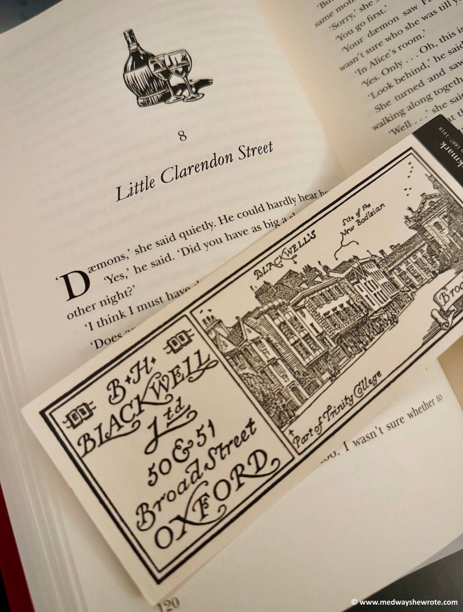 A copy of The Secret Commonwealth, open at chapter 8, 'Little Clarendon Street'. A Blackwells bookshop bookmark lies across the open page.
