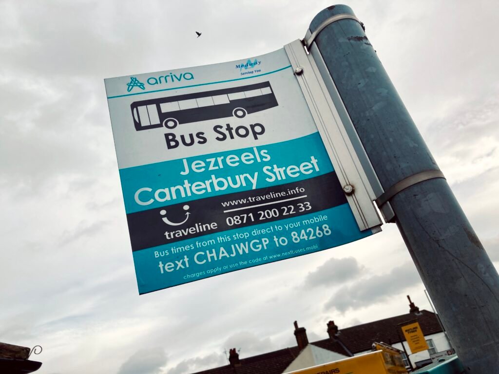 A bus stop sign in Gillingham. It is a blue and white standing sign, the name of which is Jezreels Canterbury Street. The sign has the Arriva and Medway Council logos at the top, and information about how to obtain bus times at the bottom.