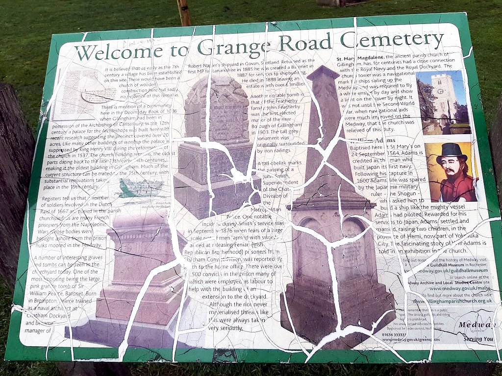 The information board at Grange Road cemetery. The information is damaged, with large cracks across the text. There is information about several historical figures relating to the churchyard, but no information about Jezreel.