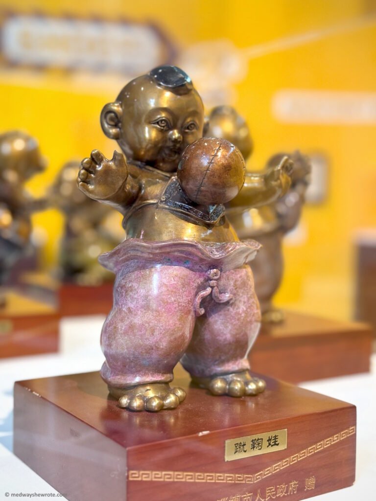 A small Chinese cuju figure controlling the ball with his chest.