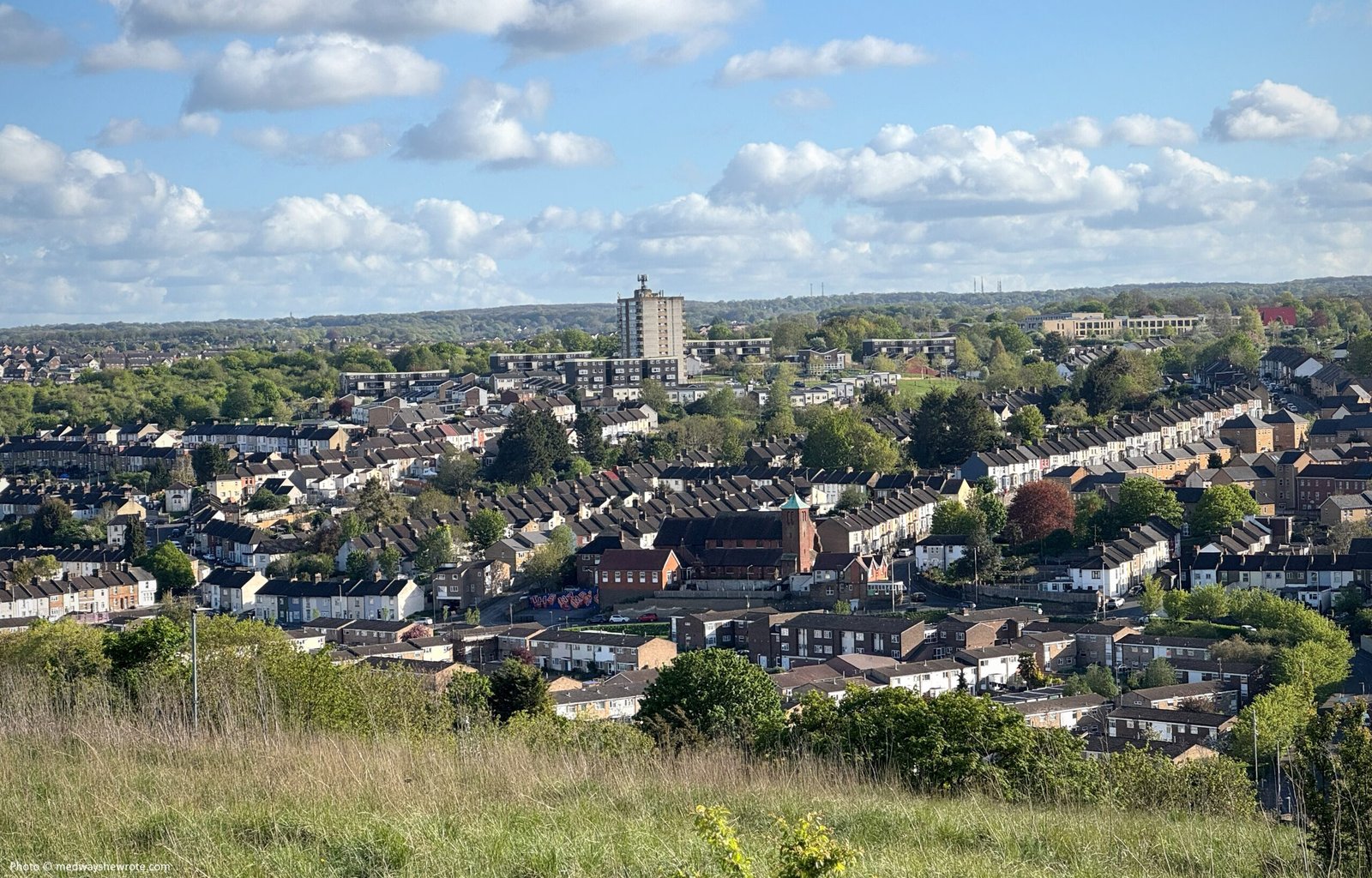 A view of Luton on a sunny day from the Great Lines Heritage Park. Luke Smile's tribute mural to George Bond is visible in the distance. 
