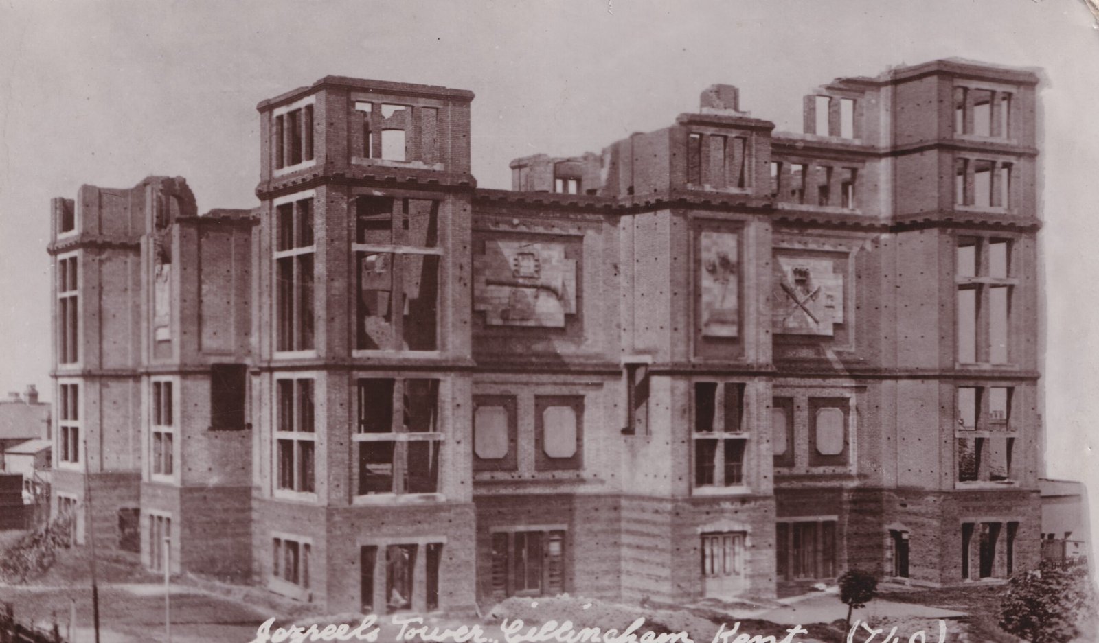 A postcard showing the half-demolished Jezreel's Tower. The postcard is a black and white photograph.